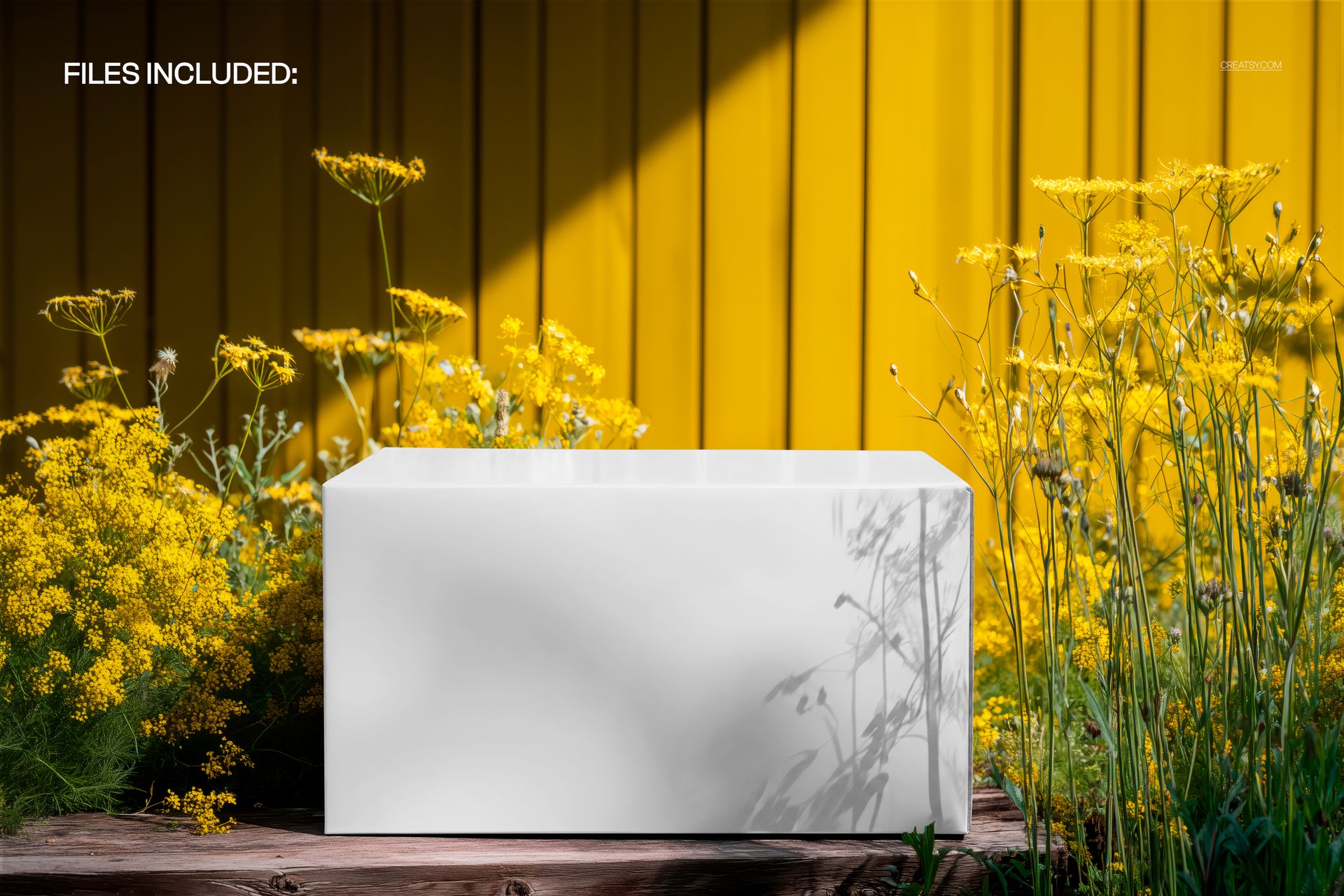 Rectangular box mockup placed on a wooden surface, surrounded by wildflowers with a yellow background.