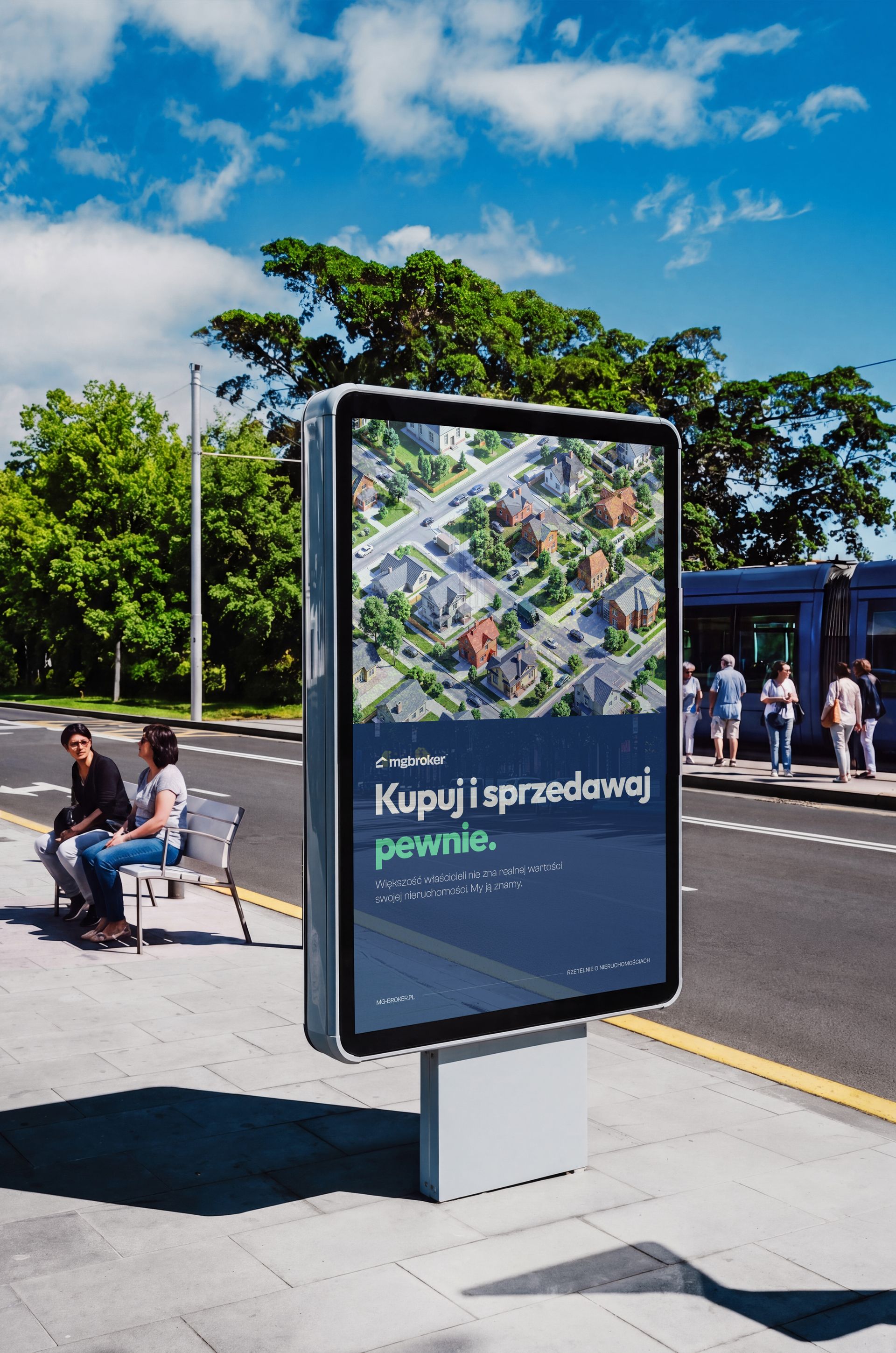 Outdoor tram stop advertising display mockup showing a vertical rectangular sign with a cityscape ad, viewed from the side.