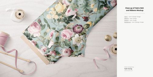 Floral fabric bolt mockup displayed with pink ribbon spools and buttons on a white textured background.