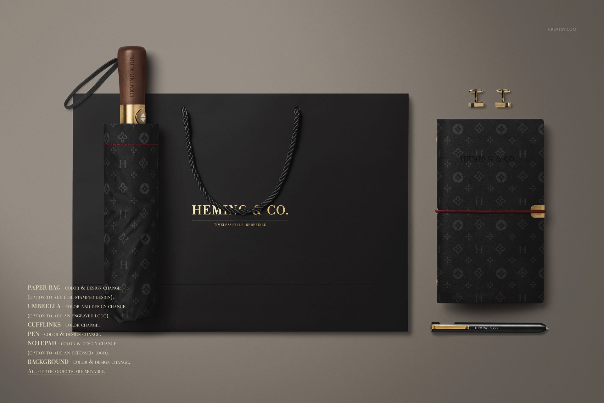 Top view of men's fashion mockup set featuring a black umbrella, shopping bag, notebook, and pen arranged neatly.