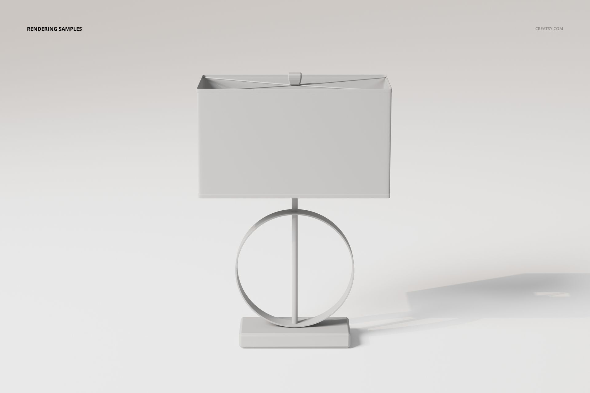 Front view of a modern table lamp with a rectangular shade and circular ring base, set against a light background.