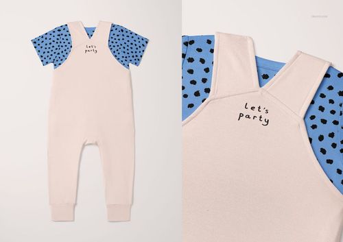 Toddler t-shirt and overalls mockup featuring light beige overalls over a blue shirt with black dot pattern, front view.