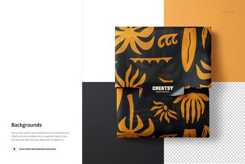 Top view of a PSD mockup showing wrapped tissue paper with a rectangular sticker and orange leaf motifs on black.