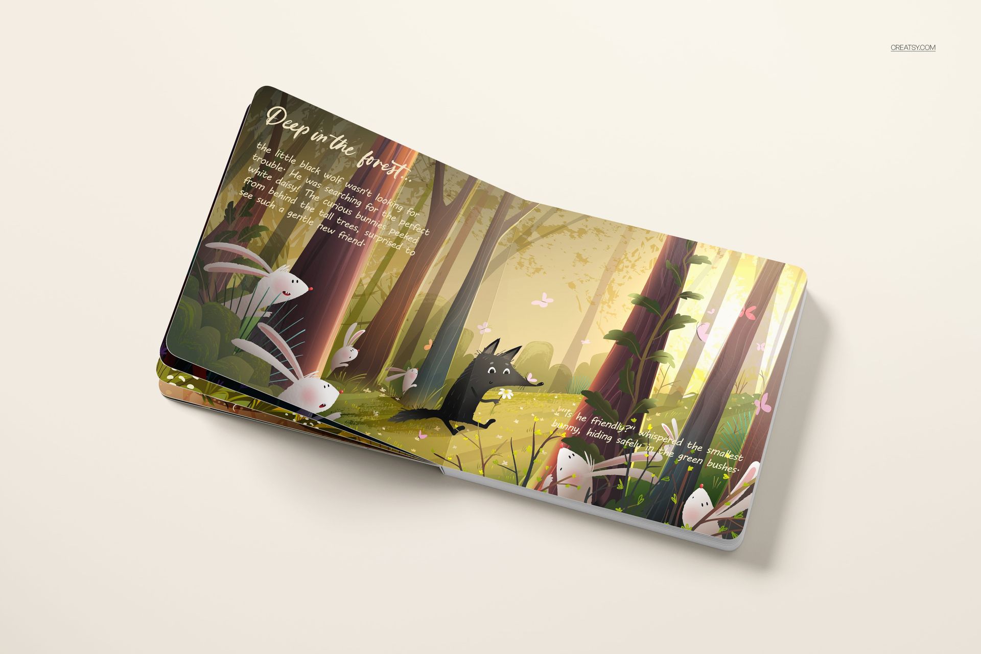 Cardboard baby book mockup showing colorful woodland illustration with greenery, animals, and soft lighting from above.