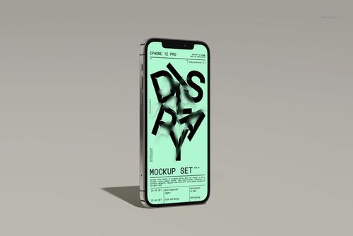 iPhone 12 Pro mockup standing upright, featuring a mint green screen with abstract black text and a subtle shadow.