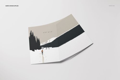 A2 cards mockup set featuring a stack of cards with a minimalist mountain and forest illustration, angled view.