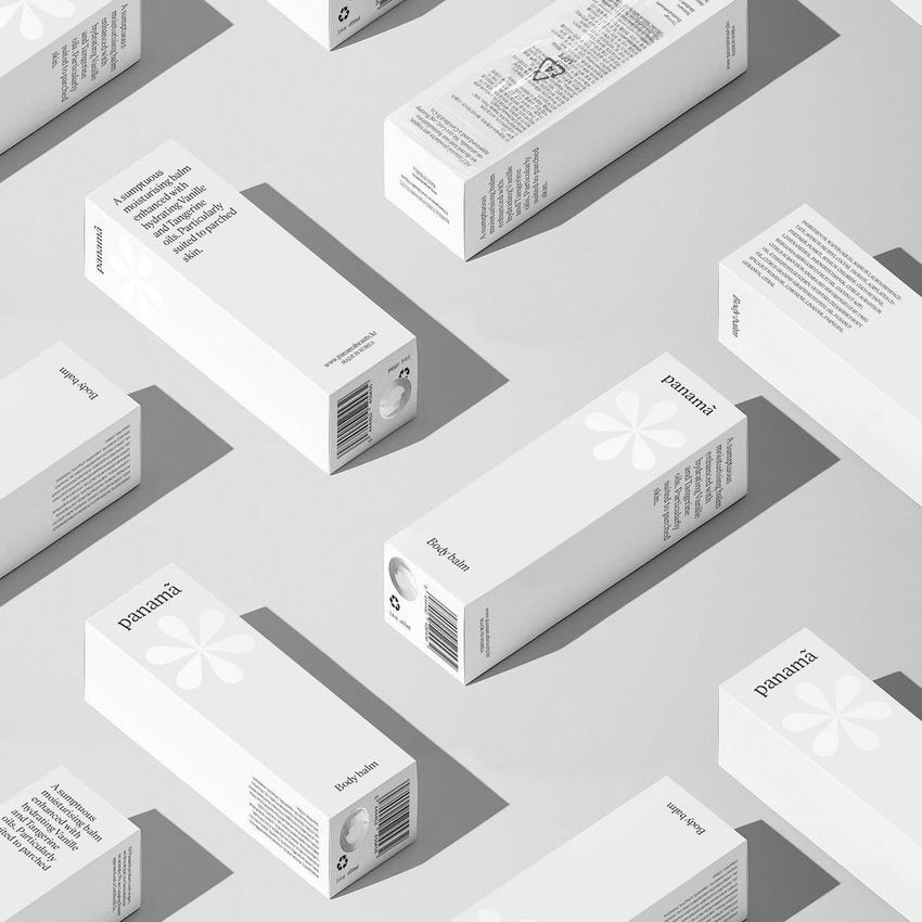 Tall box mockup featuring multiple white rectangular packaging boxes with minimalist black text and flower graphics on a light surface.