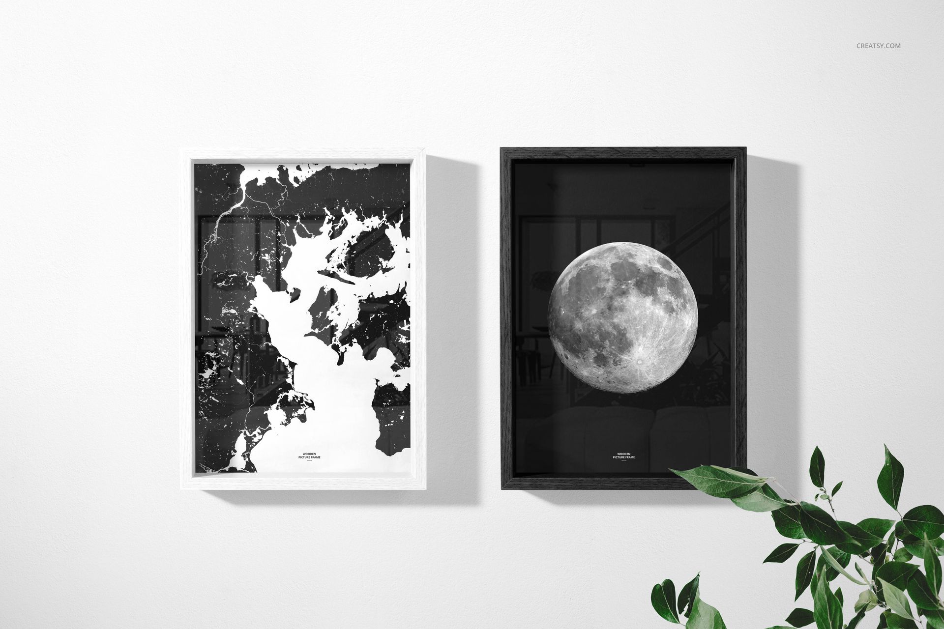 Wooden picture frame PSD mockup set with minimalist wall art, accompanied by a green plant in the lower right corner.