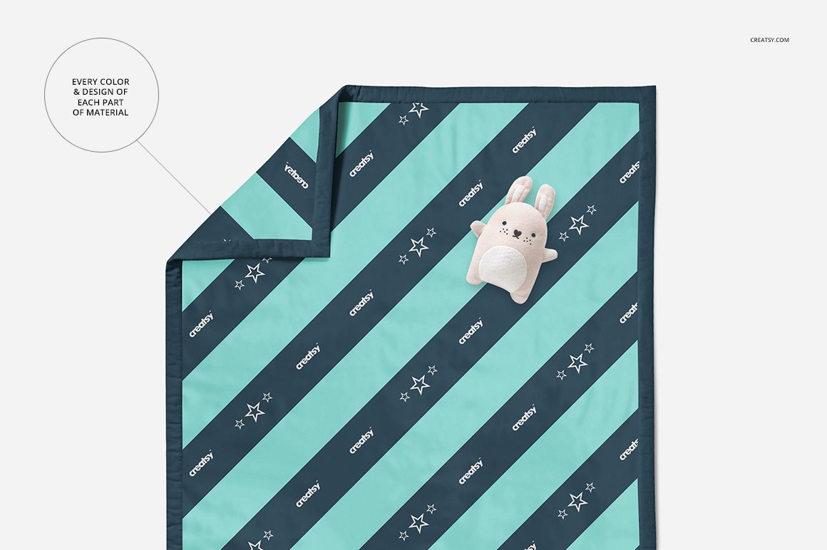 Baby quilt mockup featuring a rectangular quilt with teal and navy diagonal stripes, shown from a top view.