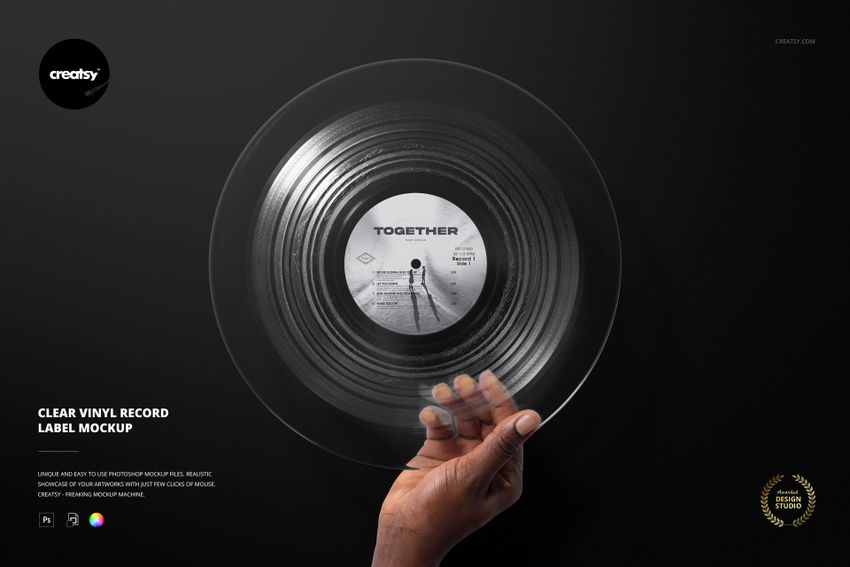 Hand holding a clear vinyl record with a custom label design, shown on a dark background in a front view mockup.