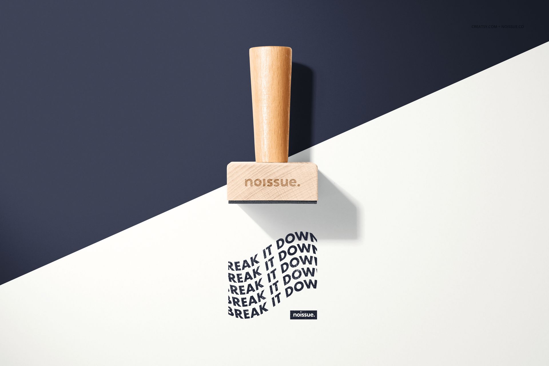 PSD mockup featuring a wooden stamp with a natural finish, casting a shadow over black and white paper.