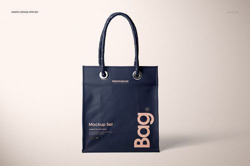 Matte PVC tote bag mockup featuring a rectangular shape, dark handles, and simple printed text on a neutral surface.