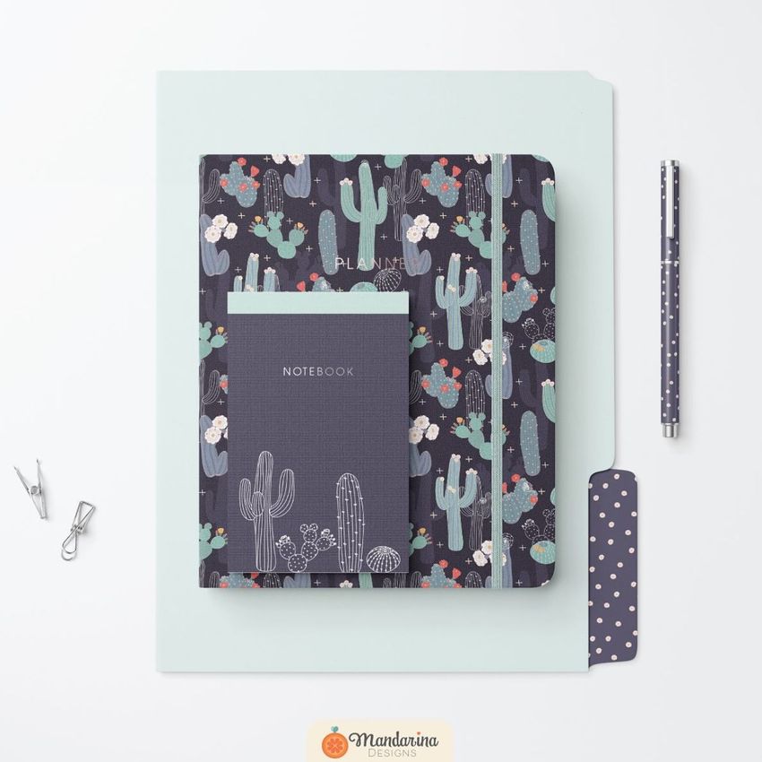 Stationery set mockup featuring a notebook, planner, and pen with cactus patterns on a light background and paper clips nearby.