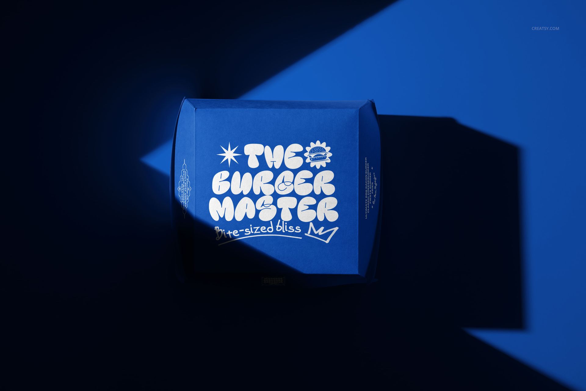 Burger box mockup with vibrant blue color and stylized white logo, illuminated by angled light and shadow.