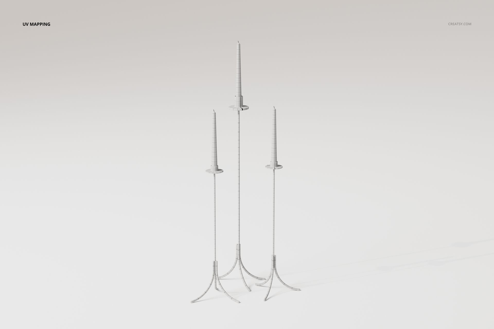 Three tall floor candle holders with slender metallic stands and circular bases, shown on a plain light background.