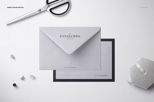 C6 envelope mockup displayed from a top view, featuring a light gray envelope with stationery items nearby.