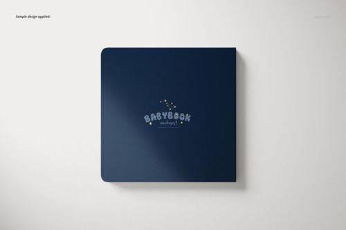 Cardboard baby book mockup showing a navy blue cover with rounded edges and whimsical lettering, viewed from above.