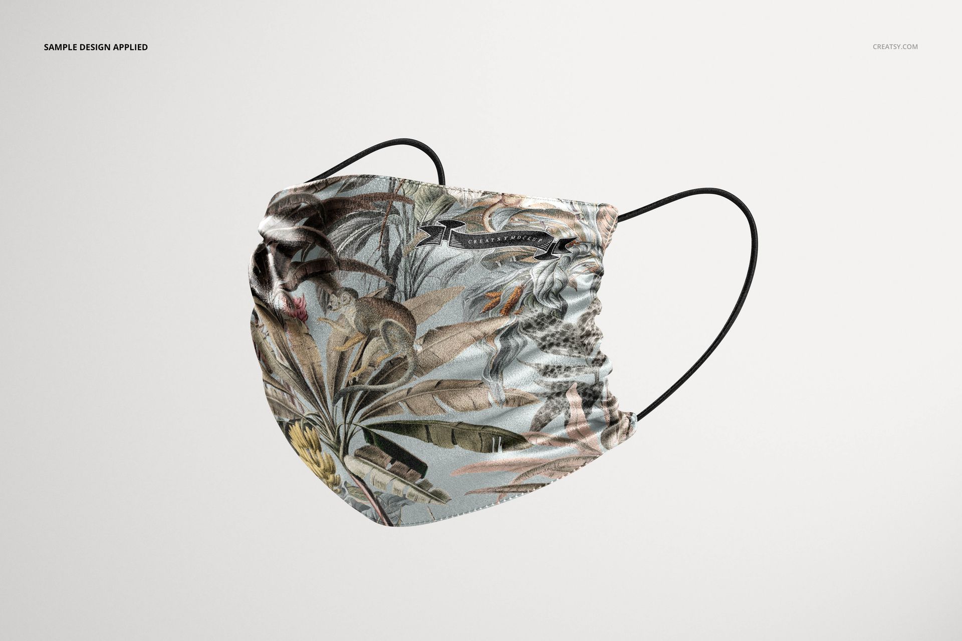 Silk face mask mockup featuring a detailed nature-inspired print, shown from a side perspective on a white backdrop.
