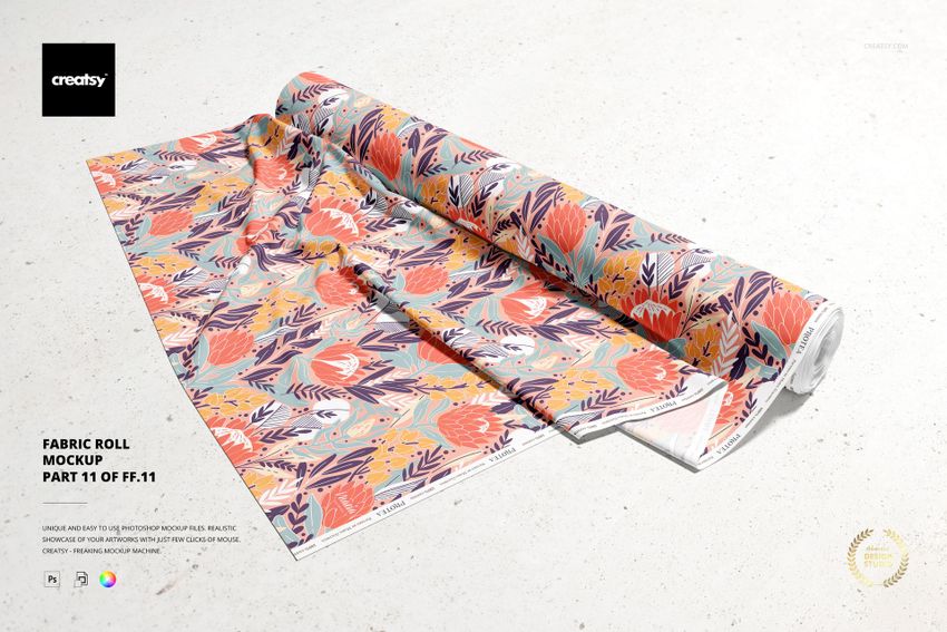 Front view of a colorful fabric roll mockup with floral and leaf patterns, displayed on a light textured surface.