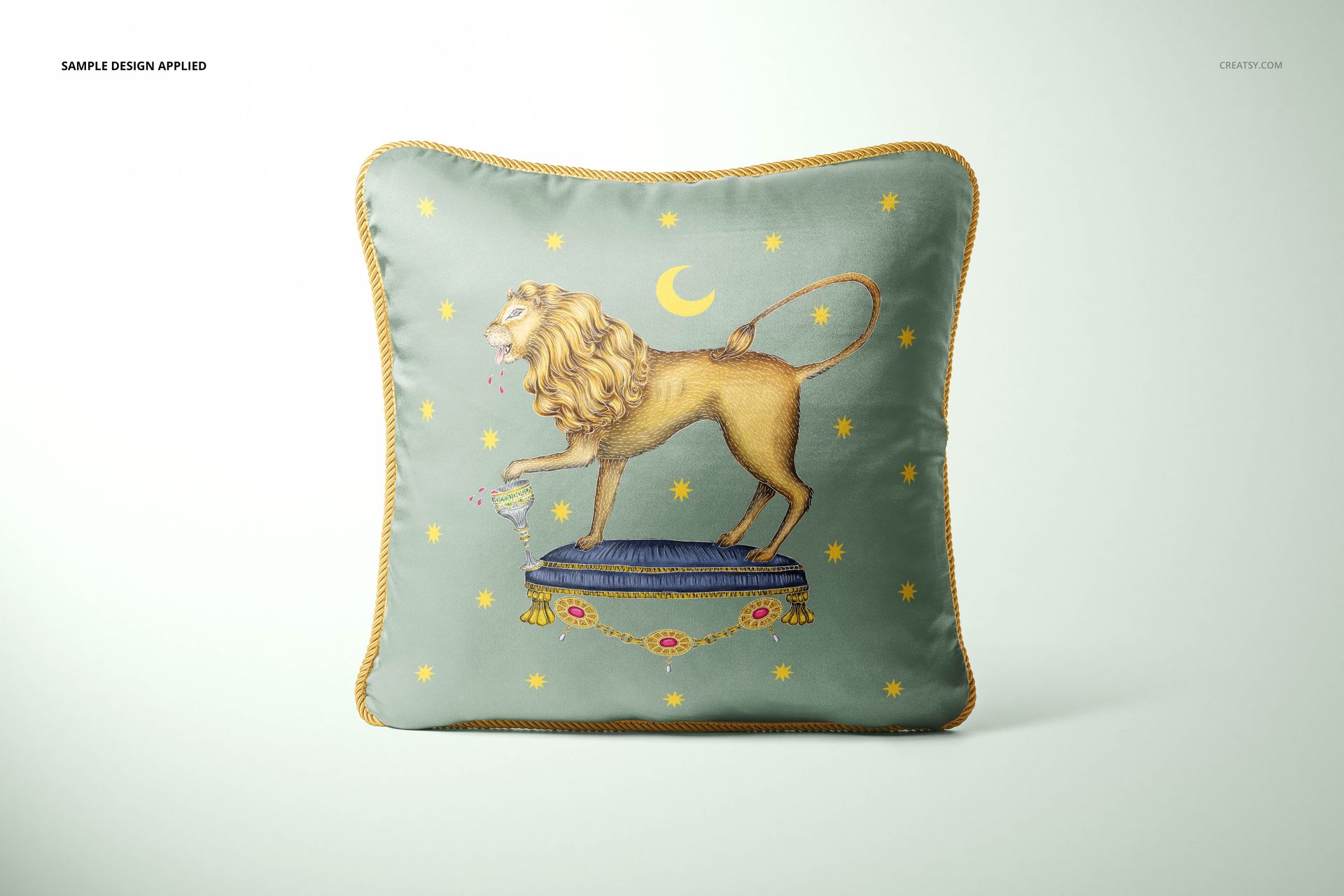 Mockup of a silk cushion with ornate braid border, displaying a lion artwork and celestial accents, set against a soft backdrop.