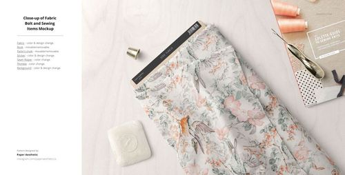 Fabric mockup featuring a bolt of patterned textile with pastel flowers and birds, shown with sewing tools nearby.