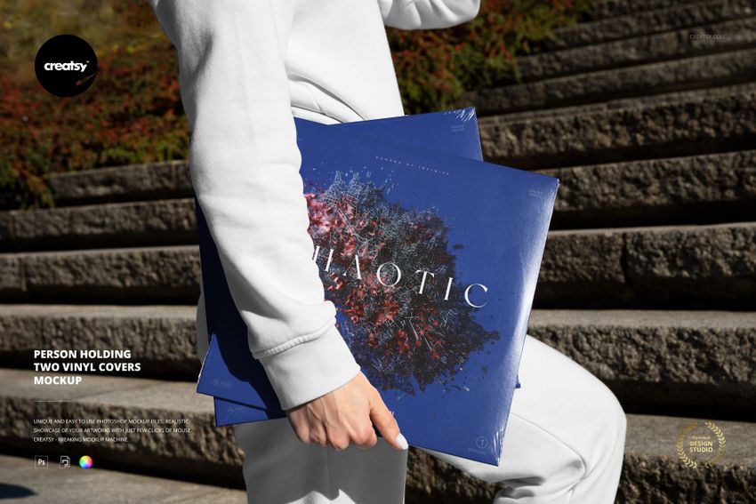 Person Holding Two Vinyl Covers Mockup - mockup screenshot 1