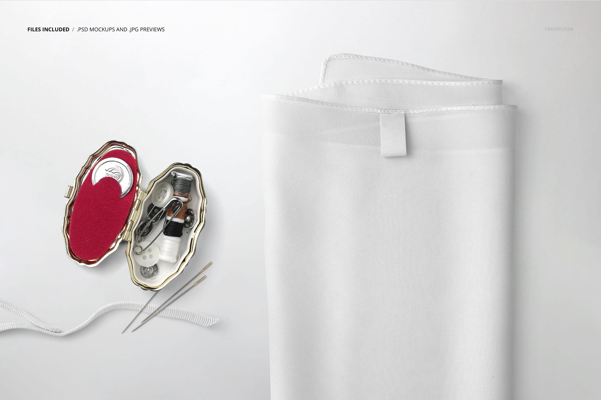 PSD mockup featuring a white silk scarf with a label, arranged near sewing accessories on a neutral surface.