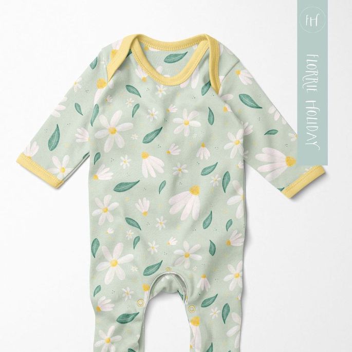 Baby chest rompersuit mockup featuring a pastel green garment with a white daisy and leaf pattern, photographed on a light background.