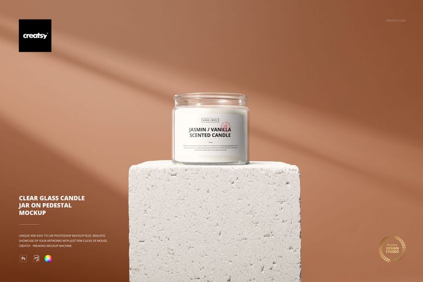 Glass candle jar mockup featuring a round transparent container with white candle, placed on a stone pedestal.