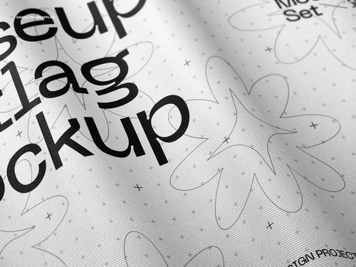 Close-up view of a fabric flag mockup with black text and abstract flower patterns on a white background.