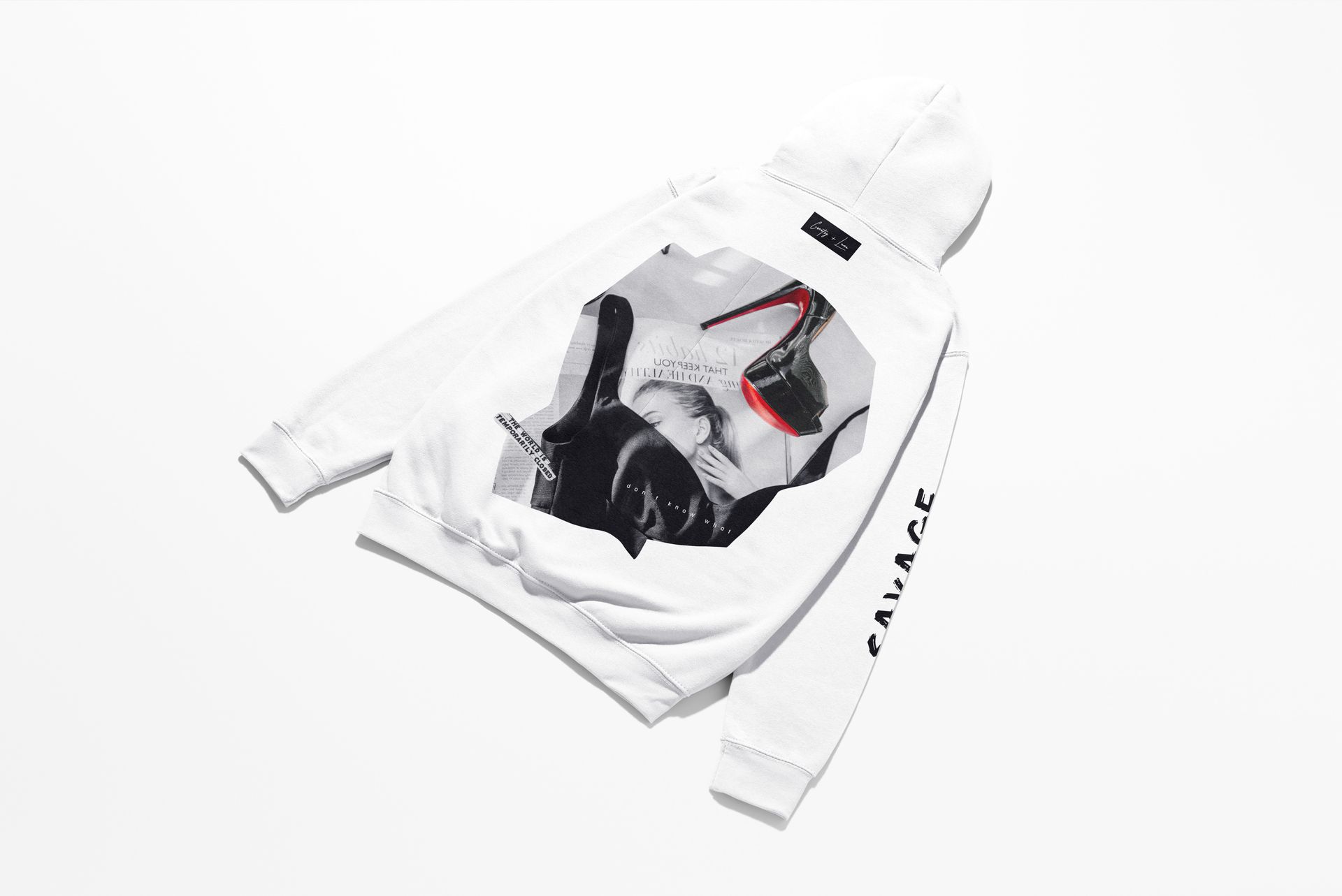 White hoodie mockup displayed from the back on a plain surface, featuring a black and white graphic with red accents.