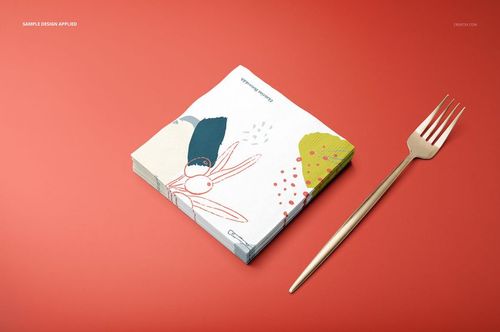 PSD mockup of square napkins with artistic design, viewed from the front, placed on a solid red background with a fork.