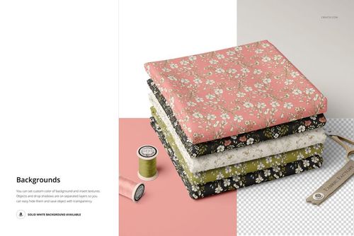 Fabric stack mockup featuring four folded textiles with small floral designs, displayed alongside sewing props and thread.