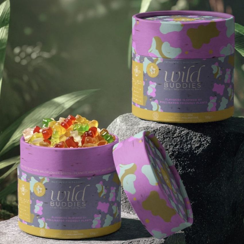 Paper tube packaging mockup for gummy bears, featuring colorful jungle-inspired patterns and vibrant candy inside.