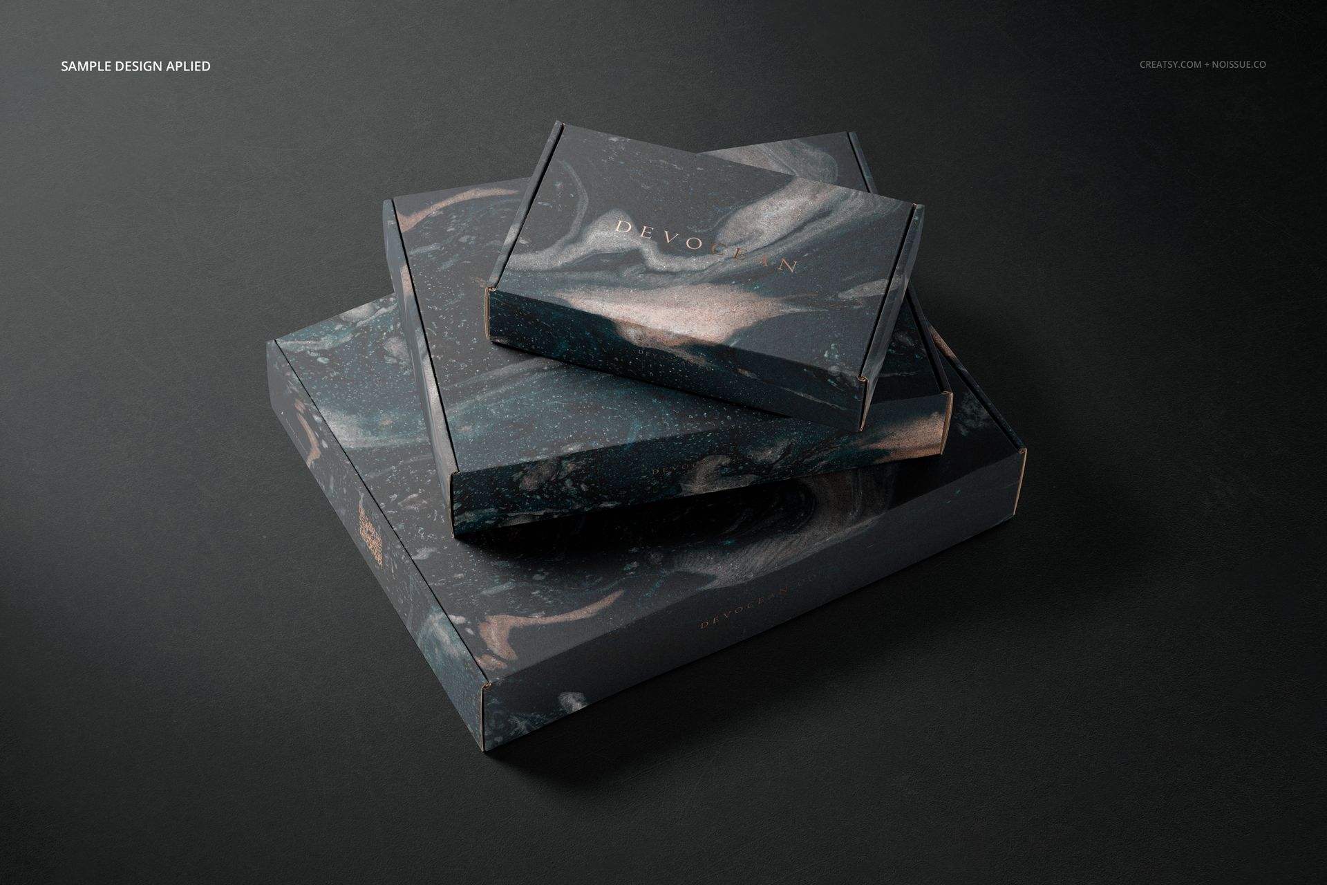 PSD mockup featuring a set of rectangular packaging boxes with swirling black and gray design, displayed at an angle.