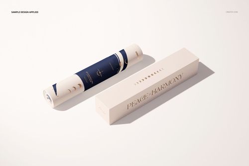 Yoga mat mockup featuring a rolled mat with dark blue and beige design beside a cream-colored box, studio lighting.
