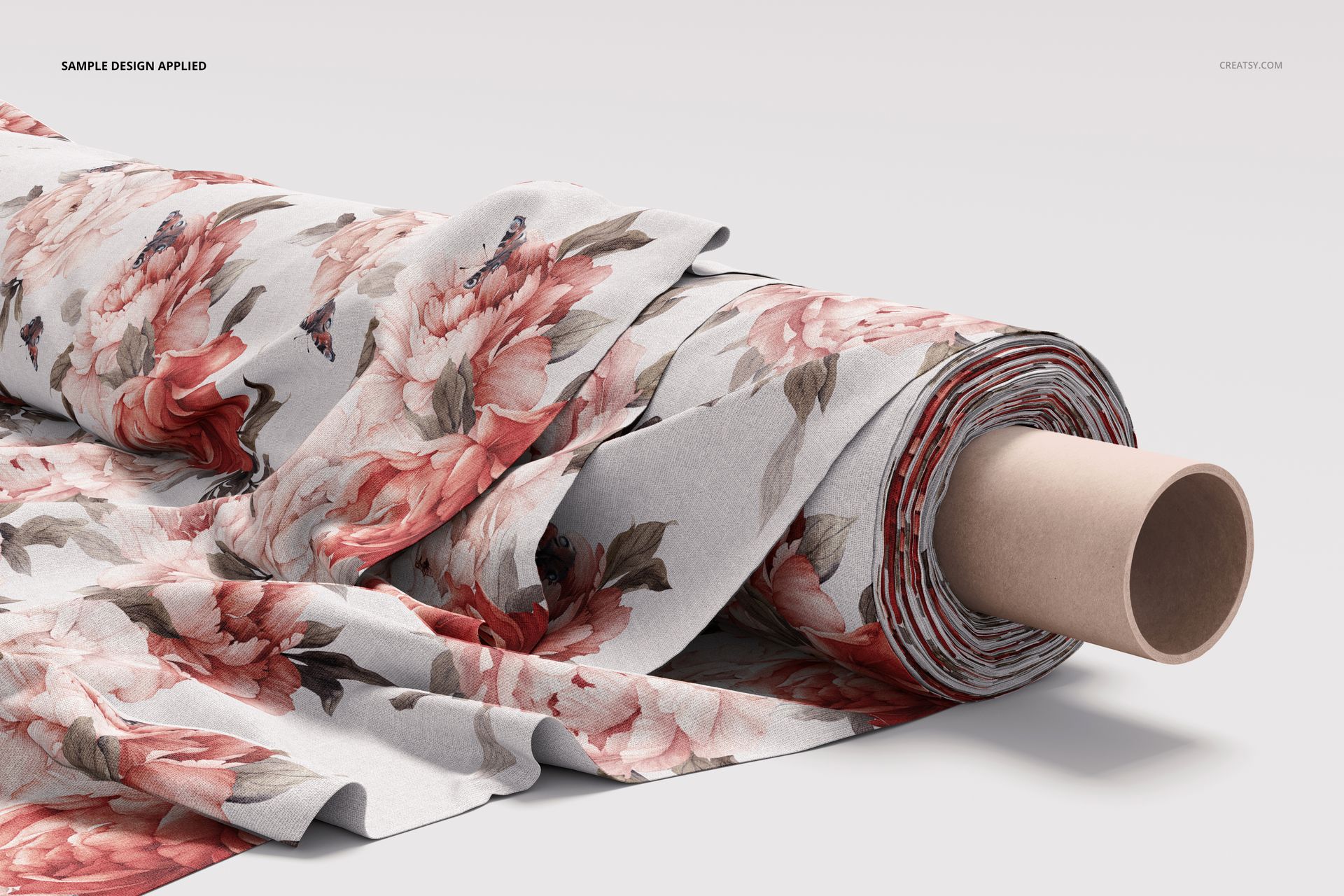 Rolled fabric featuring large pink flowers and green leaves, displayed in a realistic PSD mockup on a plain background.