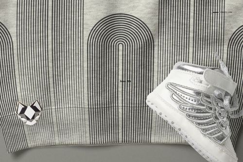 Heather baby sweatshirt mockup featuring vertical black stripes and a silver shoe with wing design in close-up.