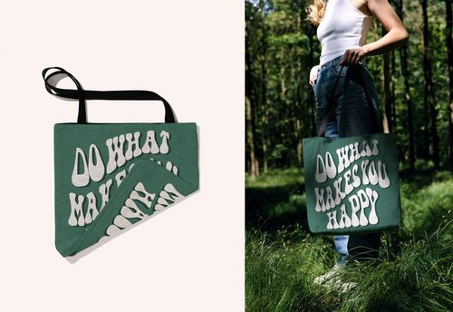 PSD mockup of a woven tote bag with graphic white text, pictured both folded and carried by a model in a sunlit forest scene.