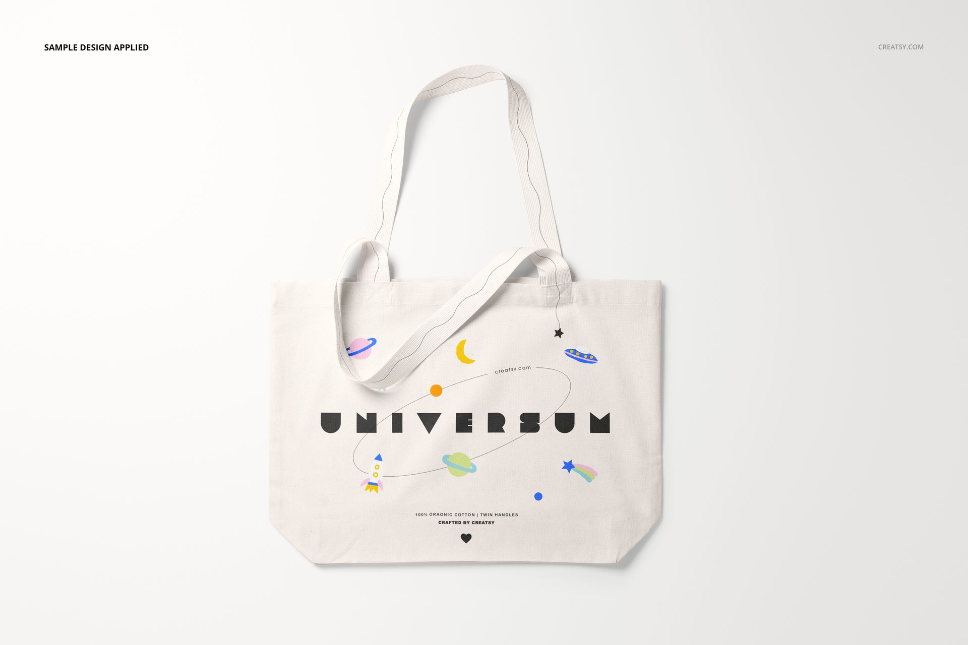 Front view of a weekender tote bag mockup with a white background, featuring playful space-themed illustrations and text.