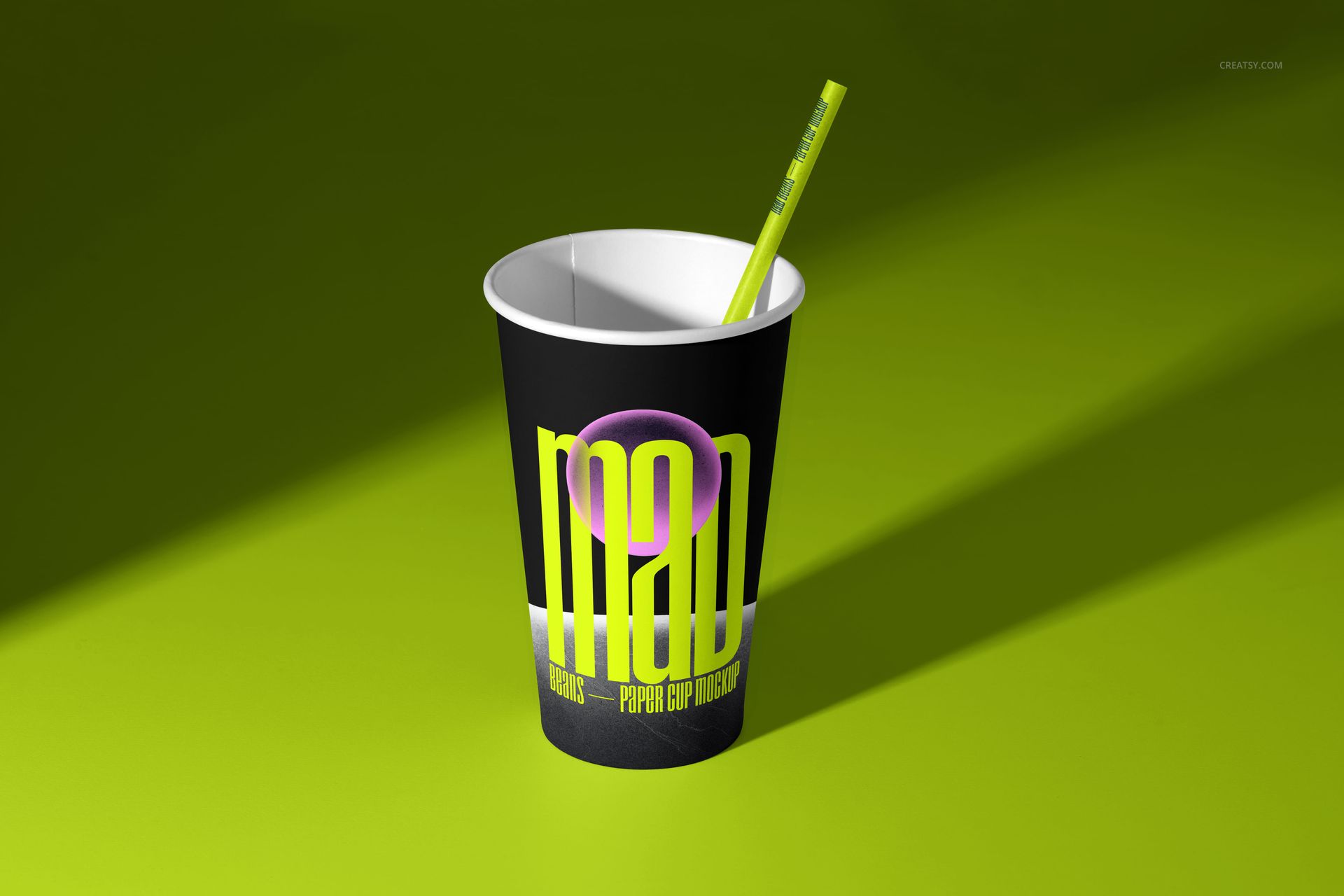 Single paper cup mockup with vibrant graphic print, green straw, and shadow effect, displayed on a bright green background.