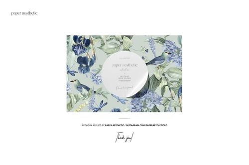 Fabric mockup featuring a detailed nature-inspired design with birds, flowers, and leaves in soft blue and green shades.