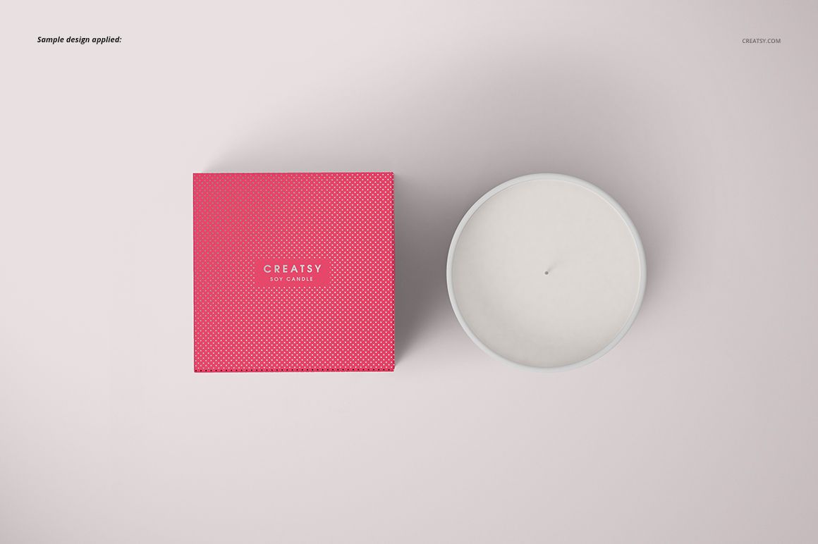 Classic candle PSD mockup featuring a matte glass candle and a bright pink box with subtle texture, both seen from above.