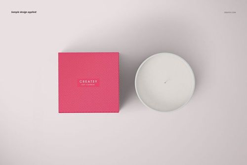 Classic candle PSD mockup featuring a matte glass candle and a bright pink box with subtle texture, both seen from above.