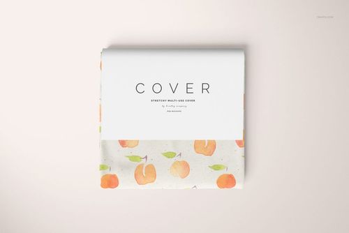 Folded multi-use cover with peach pattern, front view on light background, PSD mockup for design presentation.