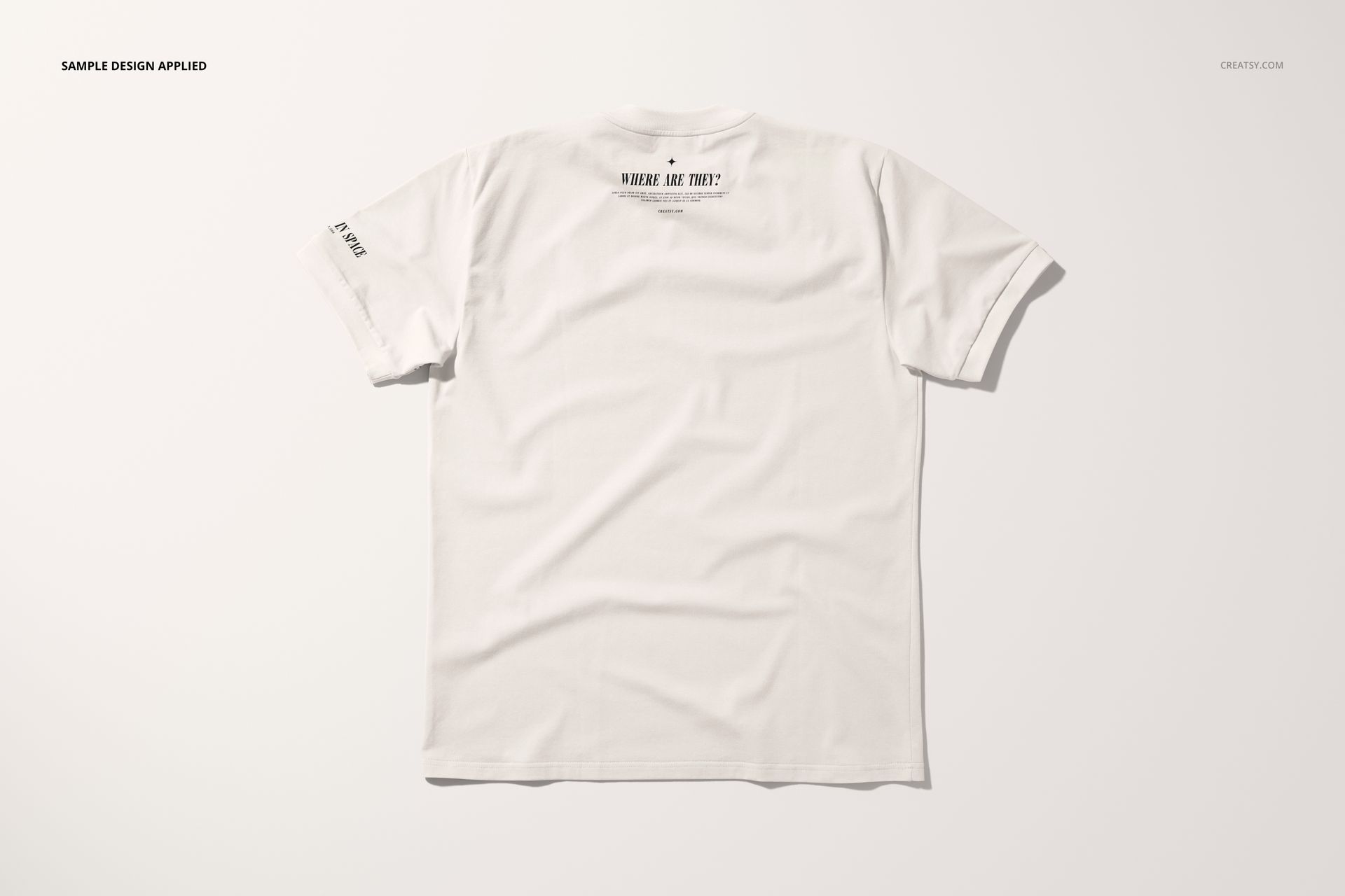 Oversized white t-shirt mockup shown from the back on a plain white background with subtle shadowing.