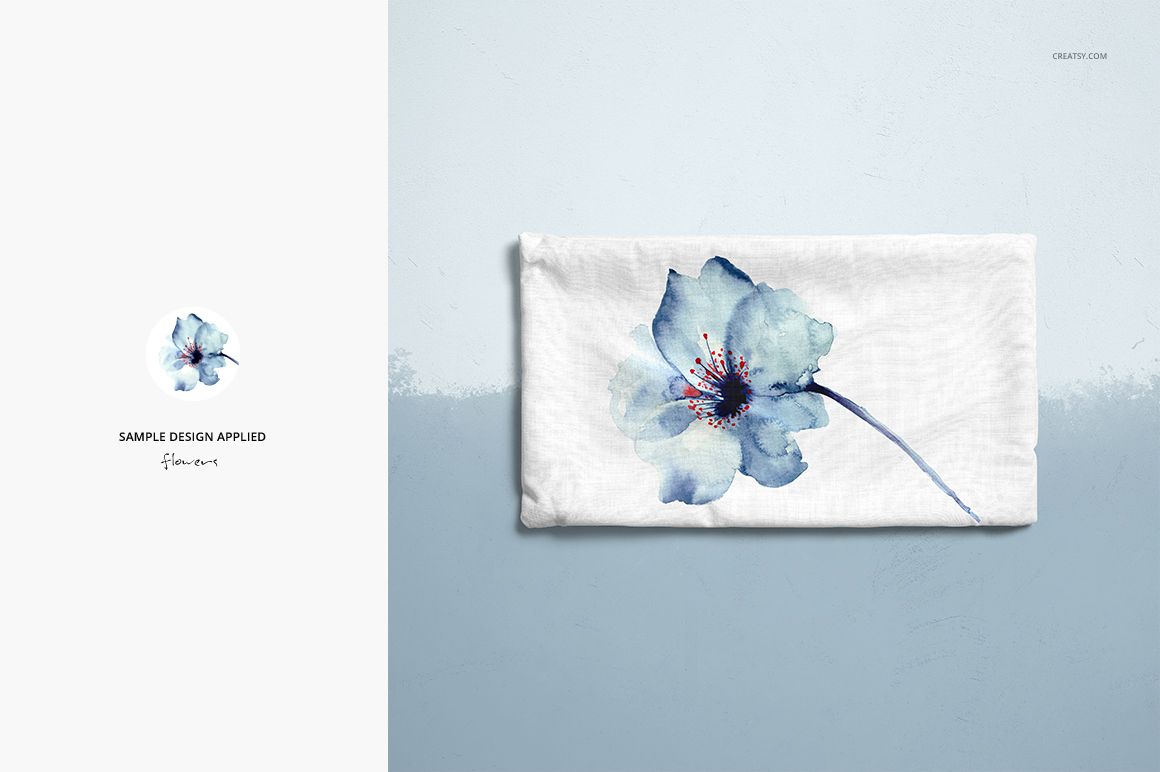 Rectangular pillow mockup featuring a single blue flower print, displayed flat on a soft gradient blue surface.