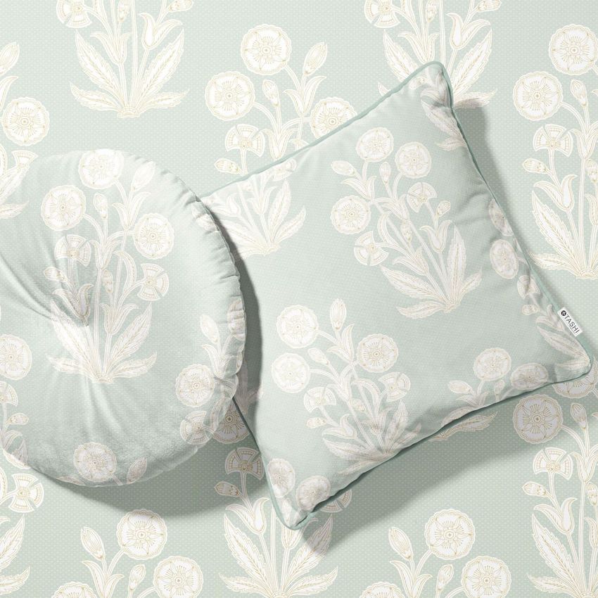 Velvet cushion mockup set with one square and one round pillow, decorated with light botanical patterns on a coordinated background.