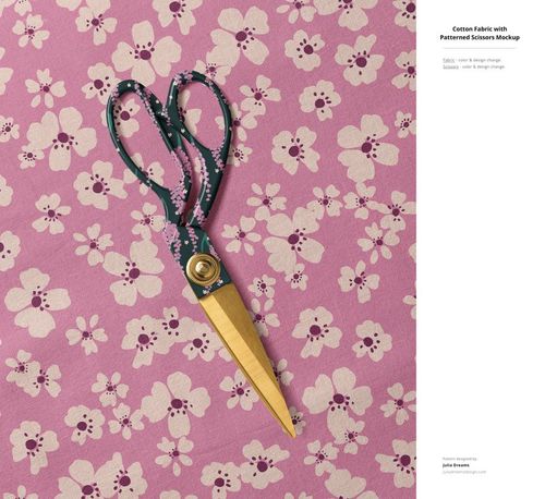 Cotton fabric mockup showing a floral print in pink and white, styled with scissors positioned on the material.