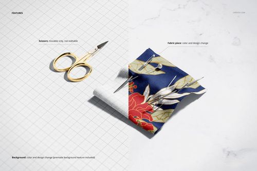 Top view of a cotton fabric piece with a floral pattern next to small gold scissors on a grid background mockup.